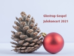 An oak tree cone with red glittering balls on a white background